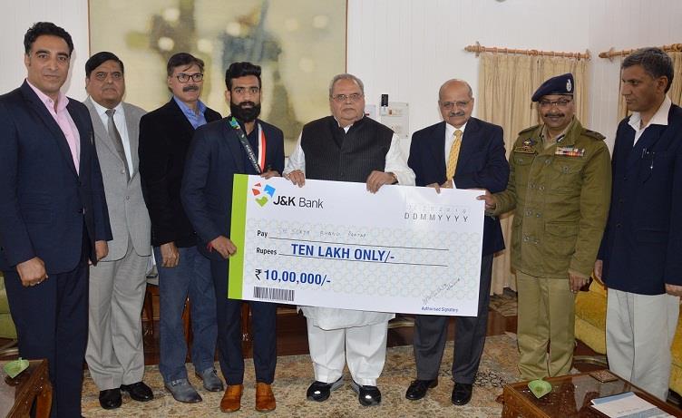 Governor felicitates Bronze Medalist Surya Bhanu Pratap, his Coach